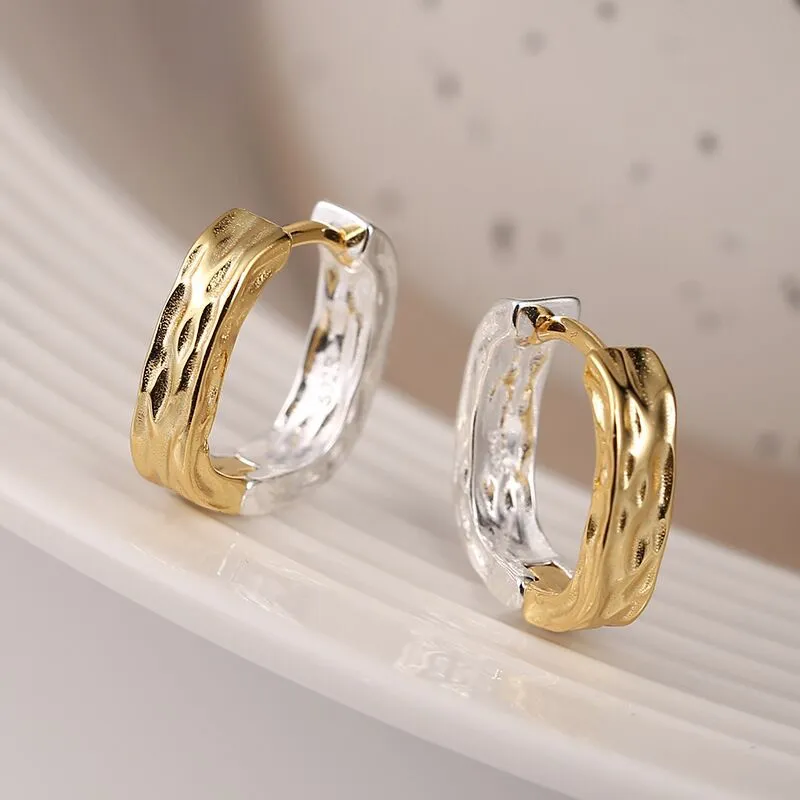 Elegante ohrringe in gold und silber