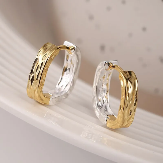 Elegante ohrringe in gold und silber